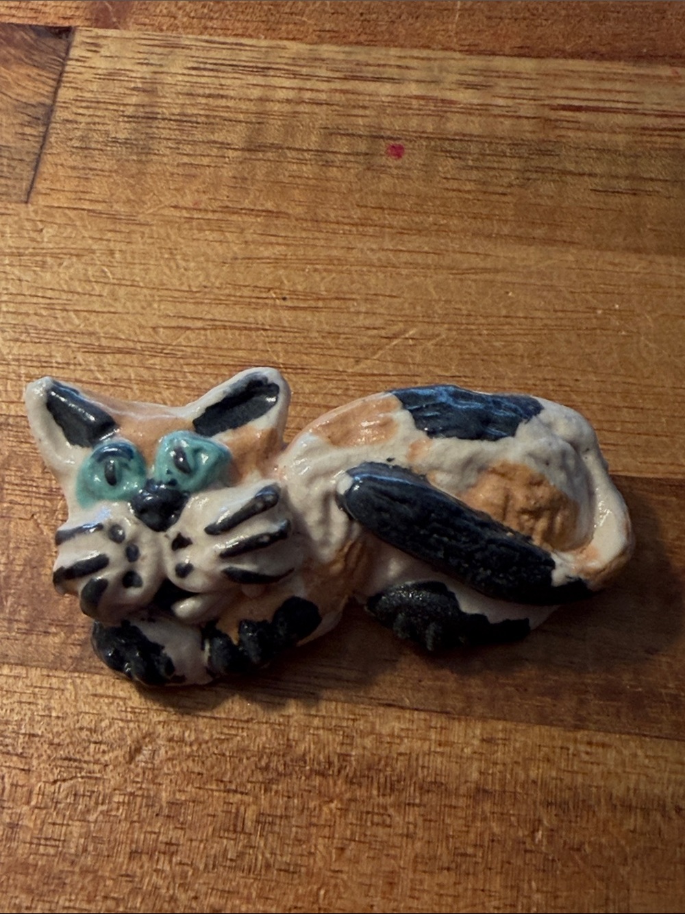 Hand Painted Clay Calico Laying Cat Brooch